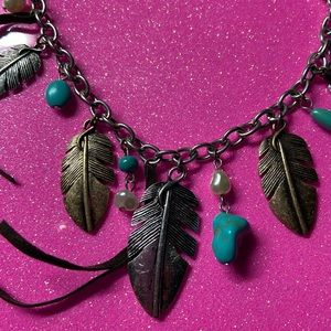 Necklace with feathers and turquoise.